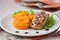 Pork steak fried on grill with mashed sweet potatoes, tasty