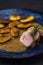 pork tenderloin with baked potatoes and French coarse mustard sauce