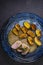 pork tenderloin with baked potatoes and French coarse mustard sauce