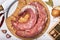 Pork tenderloin on a cutting board with ingredients