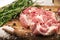 Porky steak with spice and herb on wood background