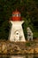 Porlier Pass Range Rear Lighthouse surrounded by greenery in Galiano Island, Canada