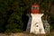 Porlier Pass Range Rear Lighthouse surrounded by greenery in Galiano Island, Canada