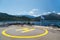 Poros, Cephalonia island, Greece - July, 17 2019: Yellow sign of helipad for helicopters at the ship and passengers