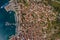 Poros Greece island. Aerial top view to down town and port with parked yachts and ships.