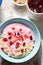 Porridge with mashed bananas, cherry yoghurt, dried cranberries with earl grey tea