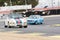 Porsche 911 2.4 being chased by a Datsun 1200 in a classic cars race