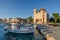 Port of Aegina town with yachts and fishermen boats docked in Aegina island, Saronic gulf, Greece, at sunrise