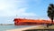 PORT ARANSAS, TX -13 FEB 2023: Crude Oil Tanker sails past people and park