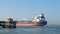 PORT ARANSAS, TX - 14 FEB 2023: Oil Tanker Ship sails past a pier