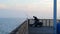 PORT ARANSAS, TX - 17 FEB 2020: Silhouette of fishermen fishing on an ocean pier at the Gulf of Mexico