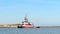 PORT ARANSAS, TX 2 FEB 2020 - KJ Leboeuf, a red and white tug boat sails on the ship channel between the Gulf of Mexico and Corpus