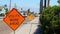 PORT ARANSAS, TX - 28 FEB 2020: Utility Work Ahead sign on sidewalk near work project zone.
