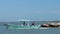 PORT ARANSAS, TX - 29 FEB 2020: Aqua fishing boat sails right to left