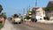 PORT ARANSAS, TX - 31 JAN 2020: Men in utility work crew prepare to use a jackhammer on a city street as traffic drives by orange