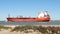 PORT ARANSAS, TX - 6 FEB 2020: A Streamline Tankers ship sails past the South Jetty on the shipping channel between the Gulf of