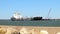 PORT ARANSAS, TX - 6 FEB 2020: The WHITE HORSE, a Asphalt Bitumen Tanker Ship, sails by the South Jetty toward the Gulf of Mexico