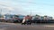 PORT ARANSAS, TX - 8 FEB 2020: Colorful golf cart with four women turns left at an intersection next, to a cart rental busines