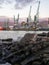Port area. Cranes for ships. The atmosphere of a cargo seaport. Marine urban landscape