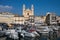 Port of Bastia view with boats, buildings and church.