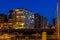 The port of Blankenberge with lighted buildings at night, city architecture and scenery of a popular town in Belgium