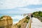 Port Campbell, Victoria Australia - 11 December 2021 - Tourists sightseeing on the lookout boardwalk at the 12 Apostles on the