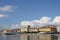 Port city, Rijeka, Croatia, coast in the city, buildings on the shores of the port, ship moored in the port, big white clouds in t