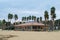 Port Cogolin beach shore rainy day with wind palm trees