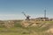 Port crane in an abandoned fishing port on the dried Aral sea