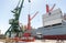 Port crane lifting container and loading ship with cargo