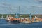 Port crane loads a container on Pier for transportation of import export and business logistic in Fredericia Denmark