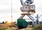 The port crane makes loading of wood chips into the freight cars of the train, loading, the sun