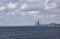 The Port of Dundee with two Oil Rigs alongside for a refit in front of the Tay Rail Bridge.