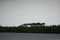 Port Everglades cargo loading cranes with trees in foreground