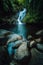 Port Glaud Waterfall on Mahe island, Seychelles. Beautiful rocks in foreground.