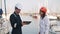 Port inspector and female seafarer shaking hands