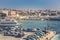 Port of La Maddalena in Italy. Boats, tourists and cars.