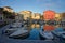 Port of Llanes and old houses at sunset