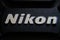 PORT-LOUIS, MAURITIUS - JULY 29, 2015: Nikon brand logo on lens cover or lens cap. Nikon is a Japanese multinational