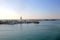 The Port of Malaga, with some small ships docked and the lighthouse on the pier, Andalusia, Southern Spain