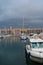 Port of Marseille at dusk, bathed in golden lights, France.