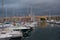 Port of Marseille at dusk, bathed in golden lights, France.