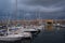 Port of Marseille at dusk, bathed in golden lights, France.