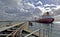 Port of Melbourne jetty and fuel transport with large tanker in dock