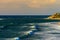 Port Noarlunga beach with surfers at sunset