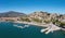 Port Paralio Astros, Arcadia, Peloponnese Greece. Aerial drone panoramic view of town, moored boat
