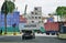 The Port of Singapore Authority (PSA) manages busy cargo container traffic at the port of Singapore