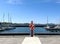 Port in Tallinn Estonian symbol flag and red  Lifebuoy on boat sea yachts on fishing   Baltic harbor sea water wave and sky ,prome