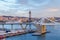 Port Vell with its bridge Porta d`Europa and the aerial tramway tower Torre Jaume I in Barcelona