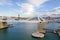 Port Vell with its bridge Porta d`Europa and aerial tramway towers in Barcelona